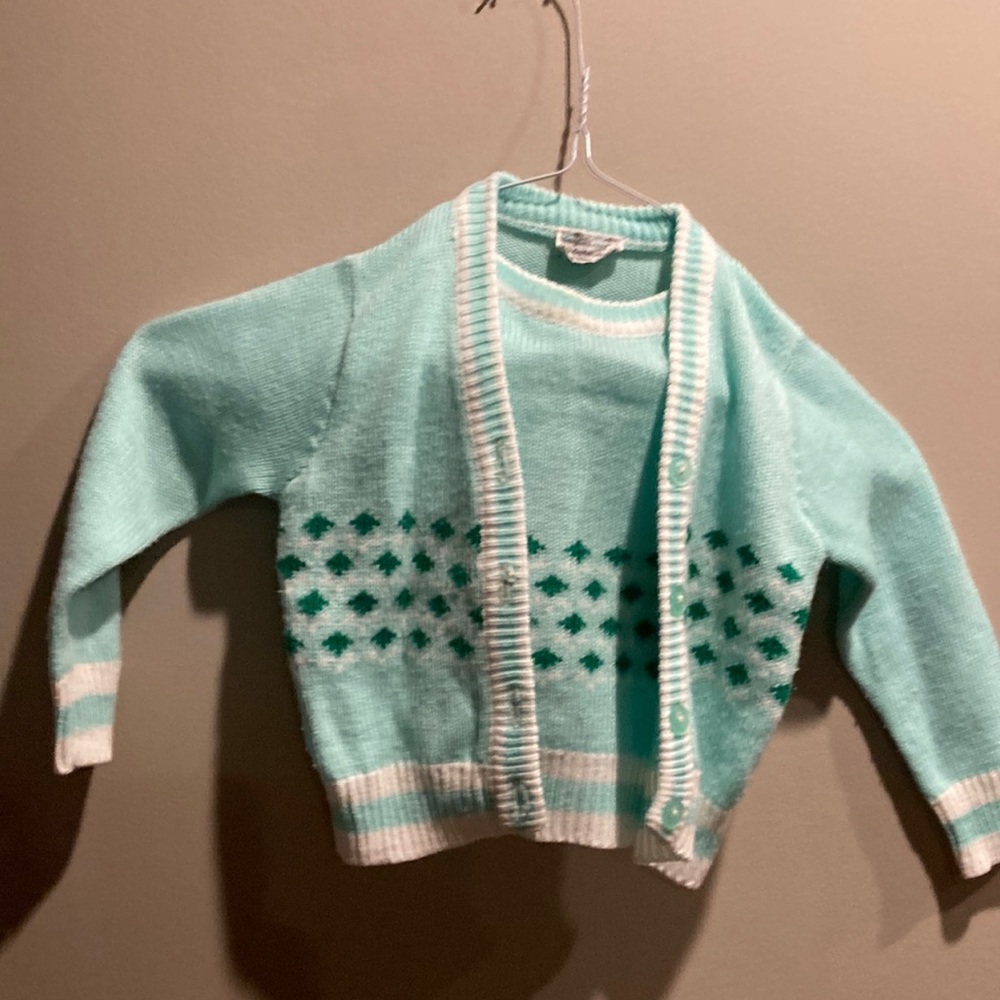 Vintage 1970 sweater light green. There is a little wear. 3T